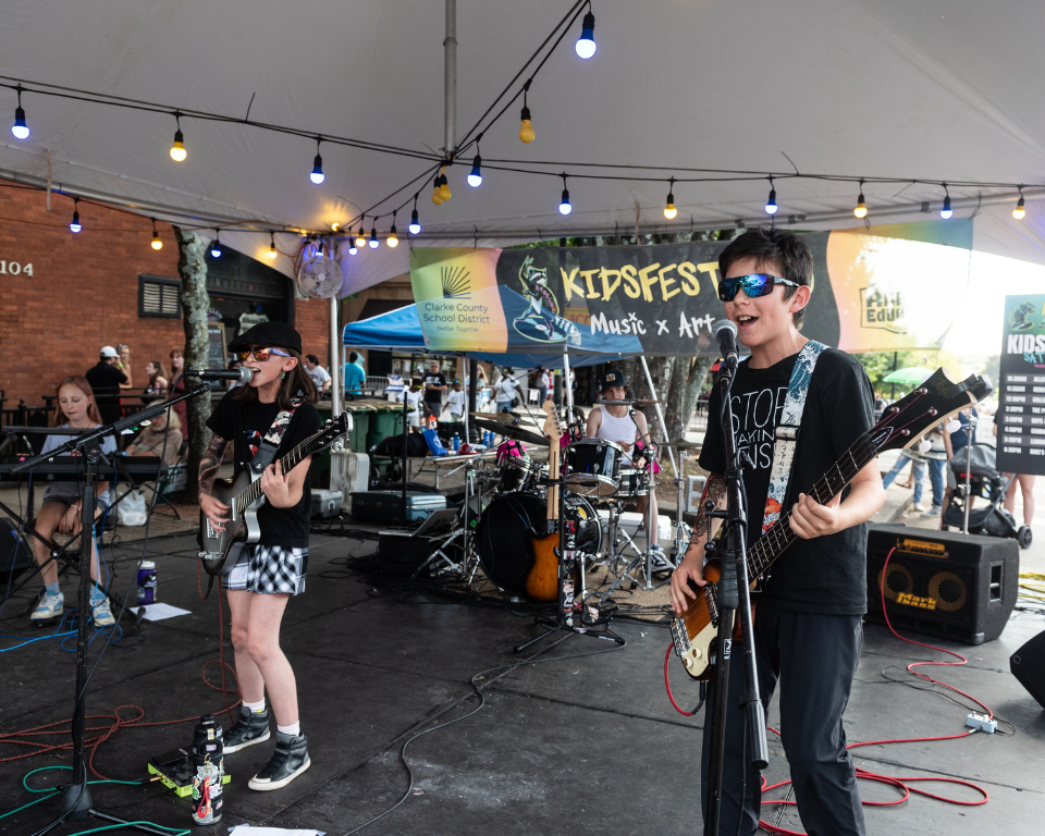 Carbon Harry performs on the KidsFest stage at AthFest 2025